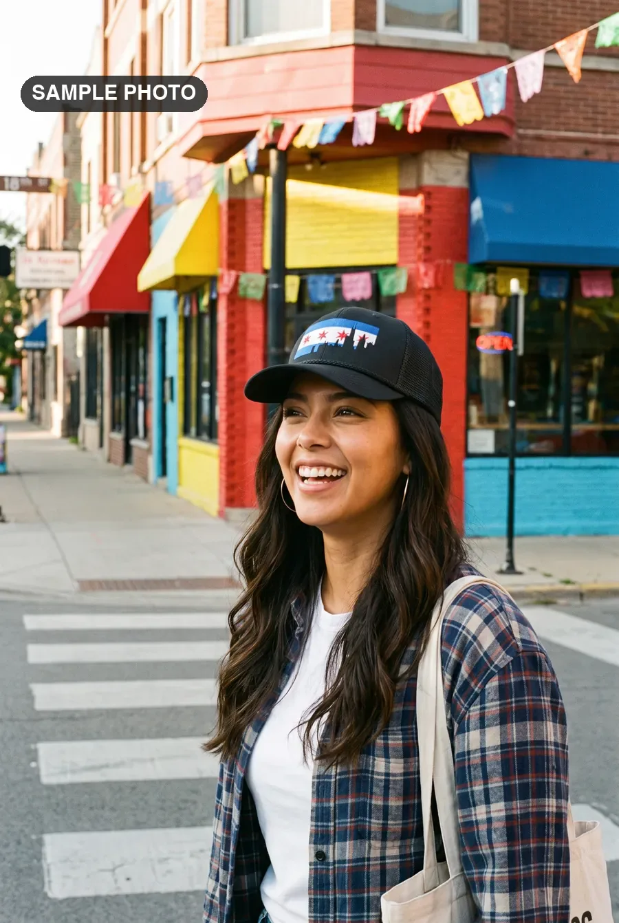 Woman in a black Chicago flag cap on 18th Street in Pilsen